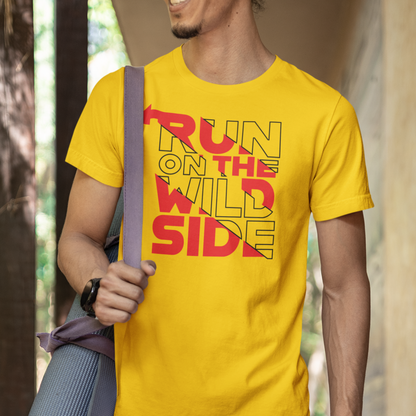 Man wearing a yellow t-shirt with 'Run on the Wild Side' text, holding a yoga mat.