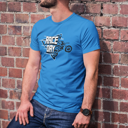 Person wearing a blue t-shirt with 'Race Day' graphic against a brick wall